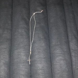 Silver cross necklace with infinity sign